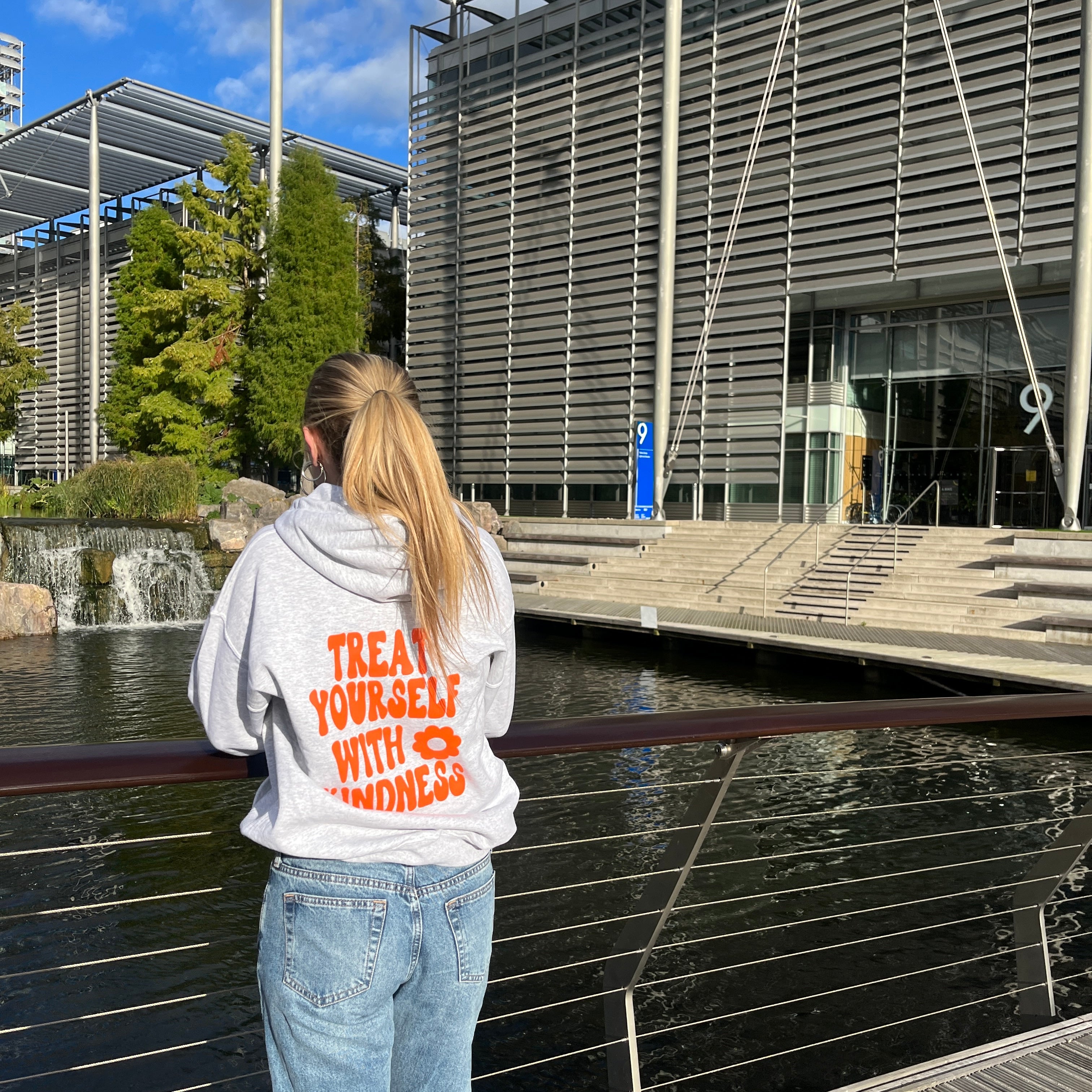 Treat yourself with kindness ash grey hoodie with orange text