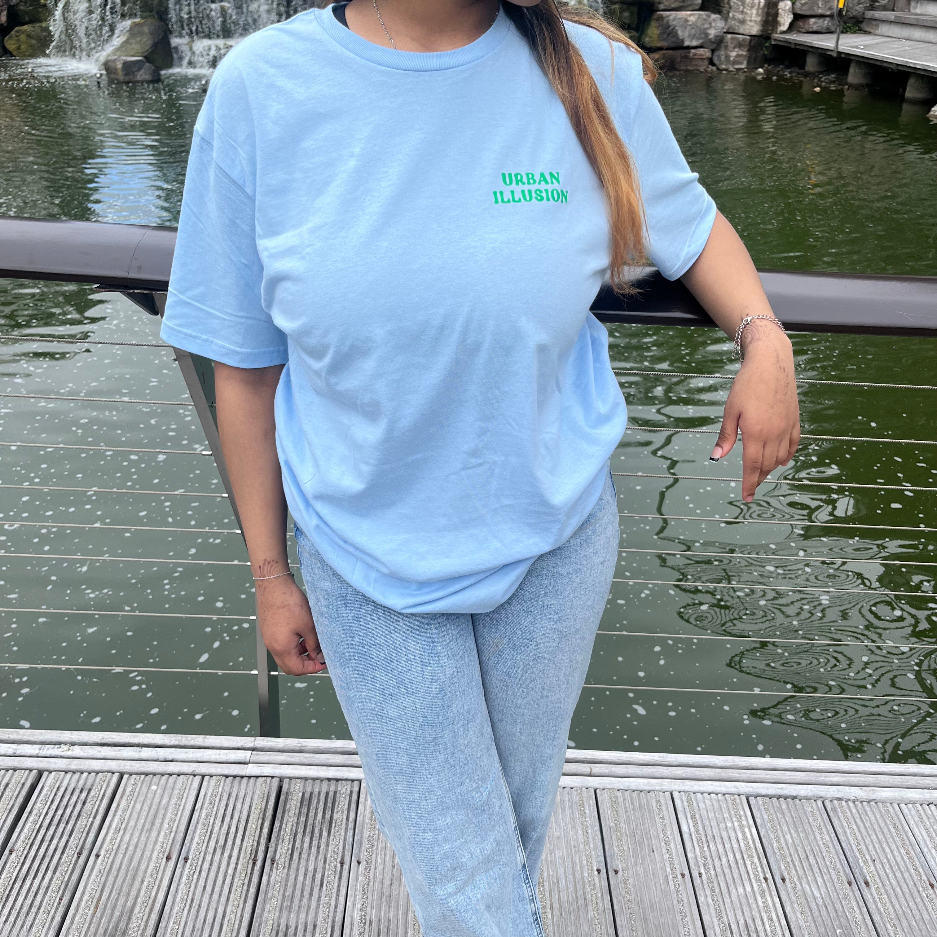 Treat yourself with kindness light blue T-shirt with green text