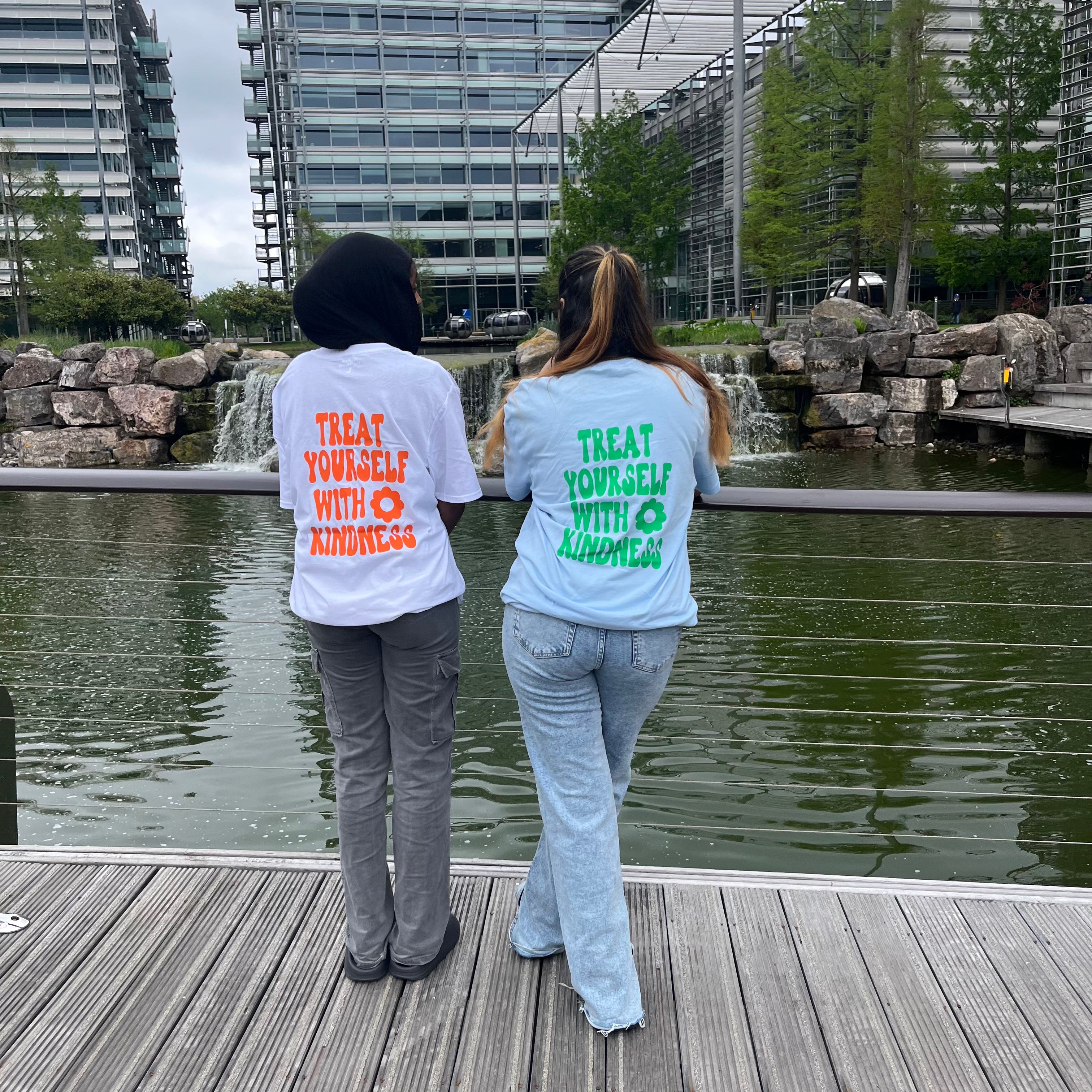 Treat yourself with kindness light blue T-shirt with green text