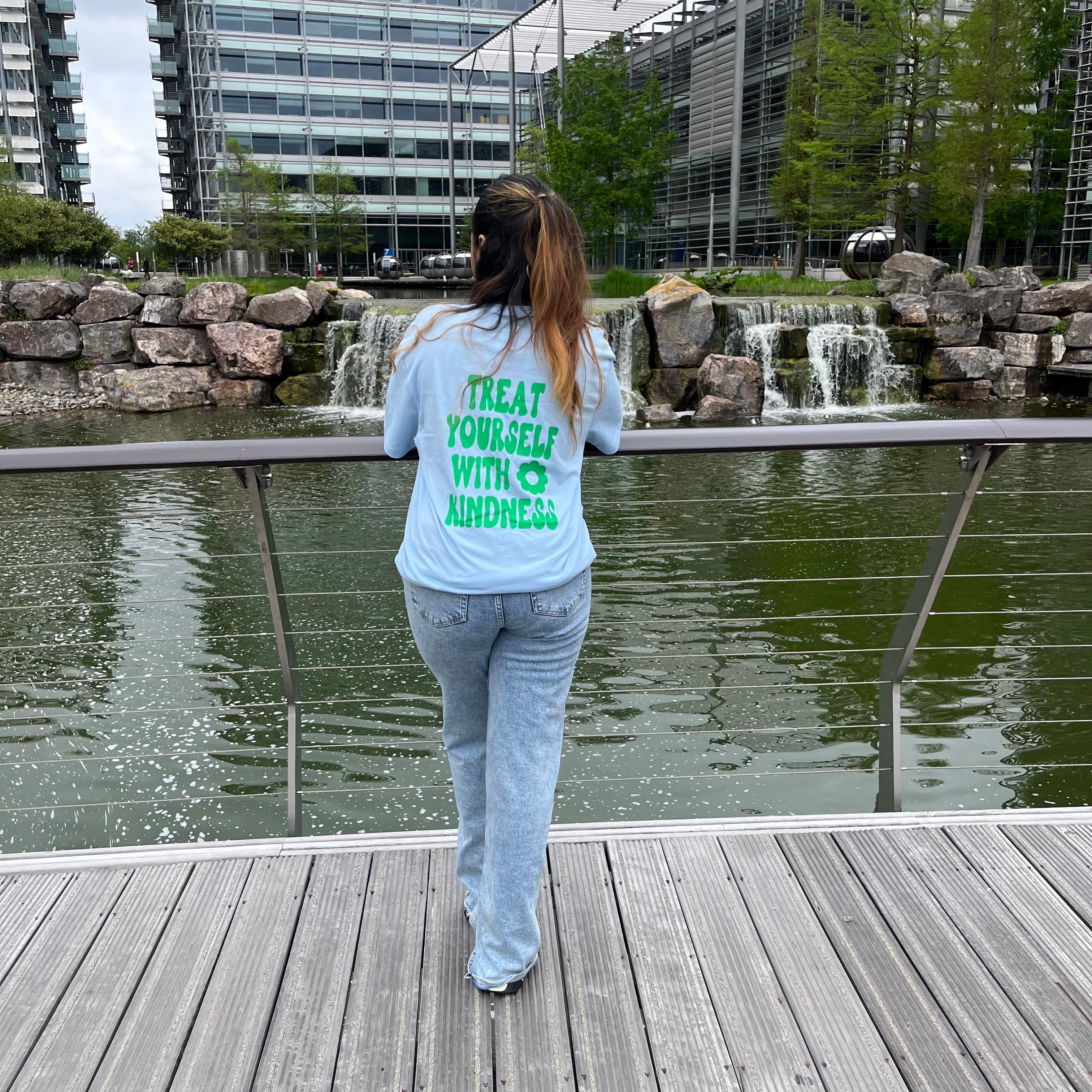 Treat yourself with kindness light blue T-shirt with green text