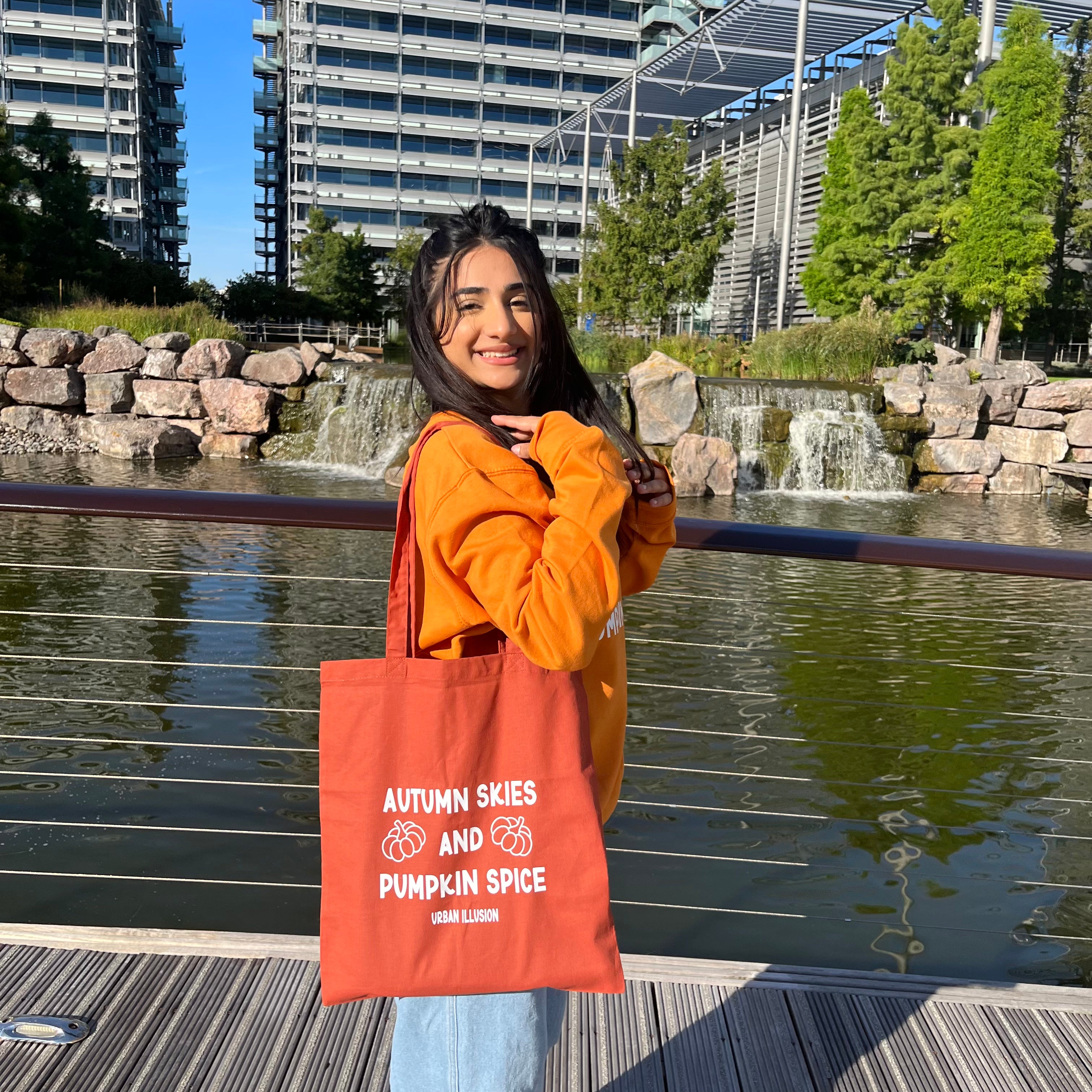 Autumn skies and pumpkin spice orange rust tote bag